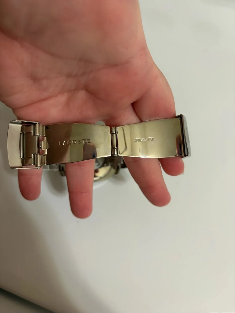 Lacoste Silver Stainless Steel Watch with Black Dial and Red Accents